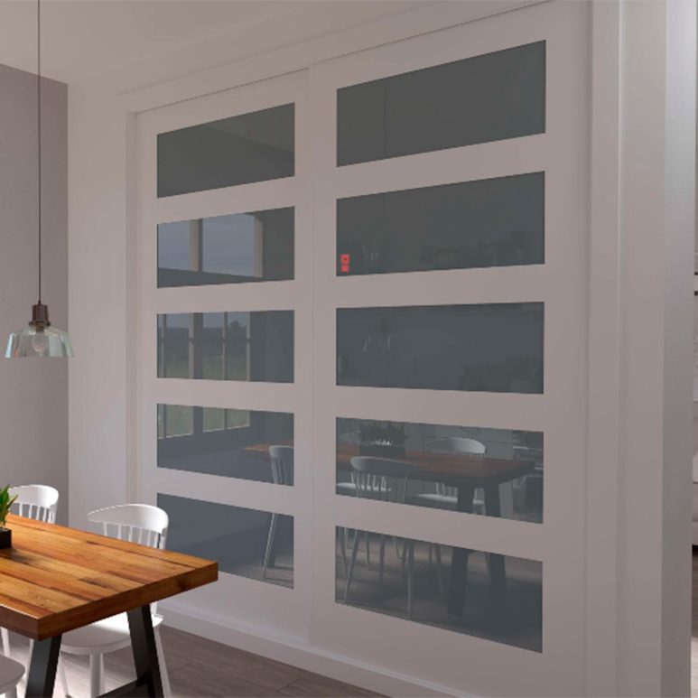 Armario de puertas correderas, modelo vidrio con marcos blancos y una mesa de madera en un entorno moderno.